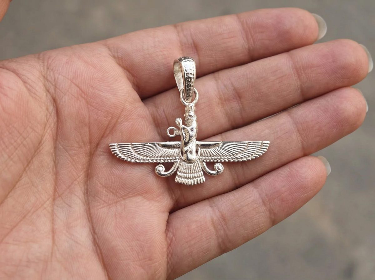 The Eternal Asho Farohar 3D 360 pendant displayed in the palm of a hand