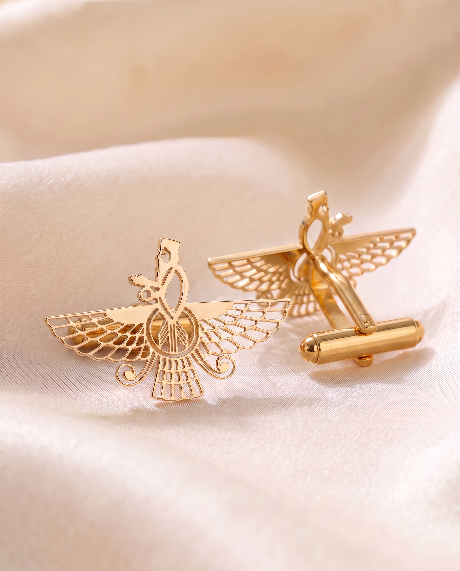 Pair of Asho Farohar Outline cufflinks in 18 karat gold, one turned to show the gold-coated brass toggle