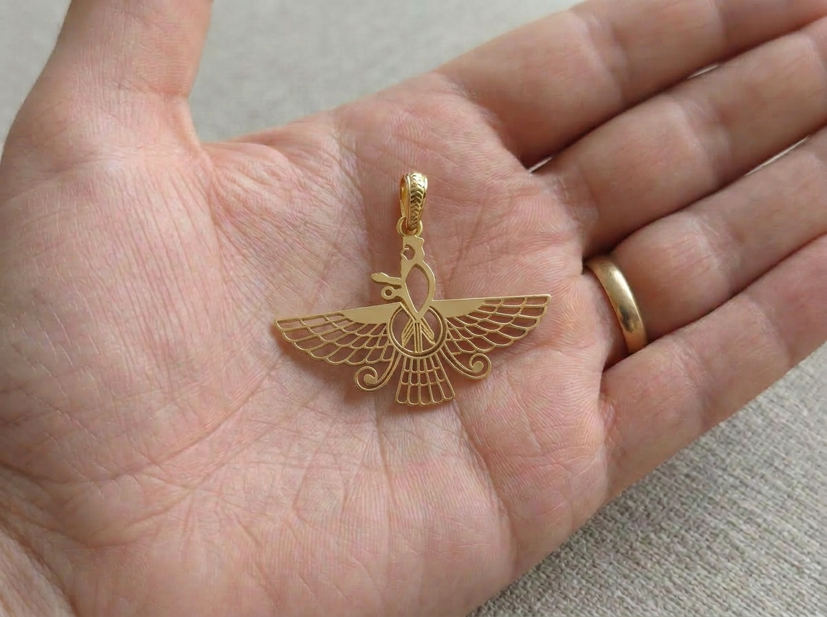 Asho Farohar Outline pendant displayed in the palm of a hand