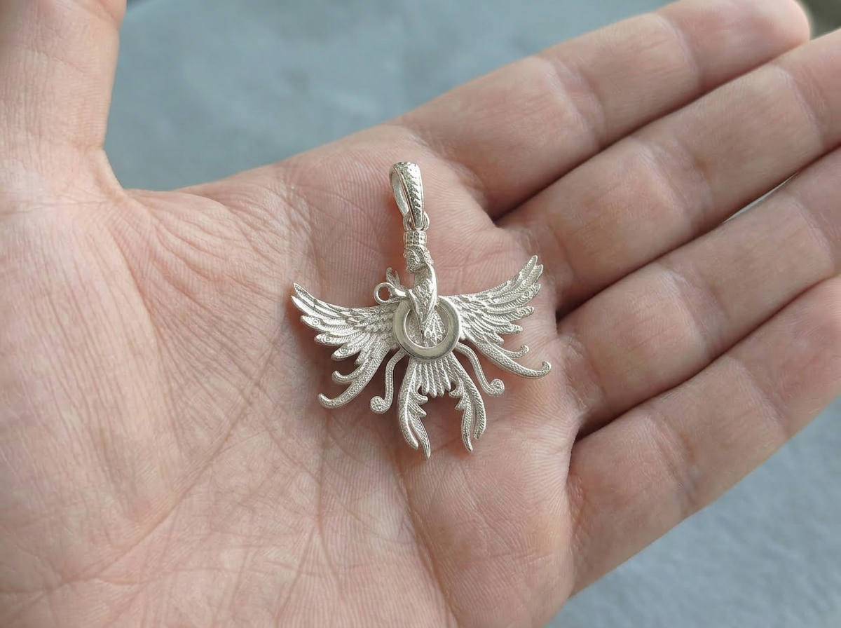 Asho Farohar Firestarter 3D pendant displayed in the palm of a hand