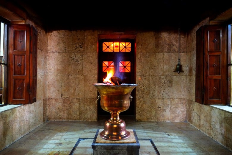 The sacred fire burning in a brass afarganyu inside a Zoroastrian fire temple
